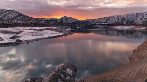 4k Timelapse Sunset taken at Lucky Peak, Boise Idaho during winter with fresh snow on the foothills.
The water was almost still which gave a perfect reflection of the clouds and sunset on the water.