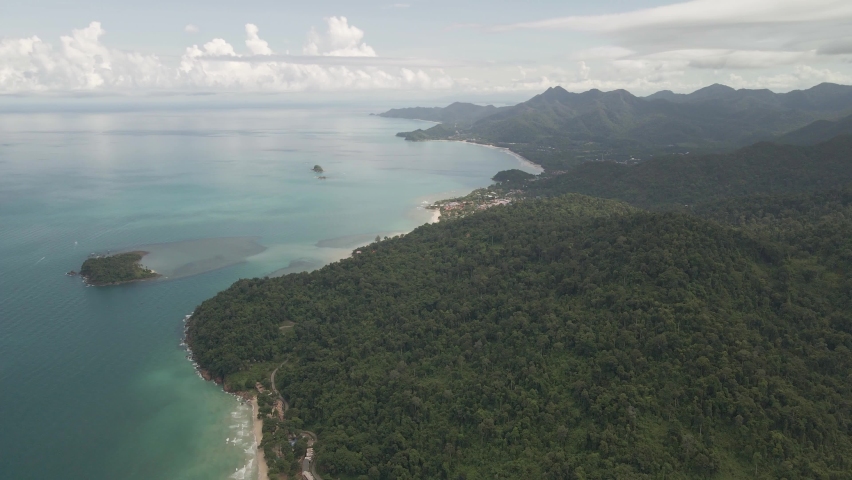 Aerial slow dolly view of Tropical island with jungle beach and tourism village on Koh Chang | Shutterstock HD Video #1085310776