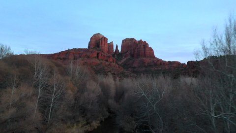 A drone view in Sedona Arizona near cathedral rook in crescent moon.