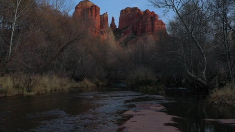 Sunset aerial drone view of Sedona Arizona. Viewed from crescent moon picnic area looking towards Cathedral rock.