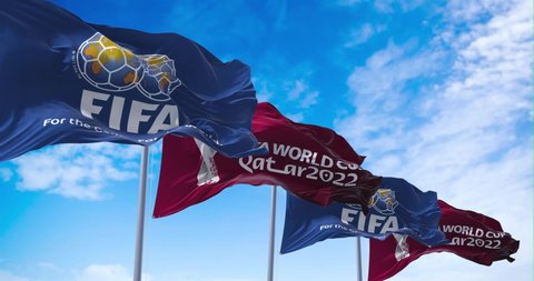 Doha, Qatar, January 2022: Animation Flags with FIFA and Qatar 2022 World Cup logo waving in the wind. The event is scheduled in Qatar from 21 November to 18 December 2022