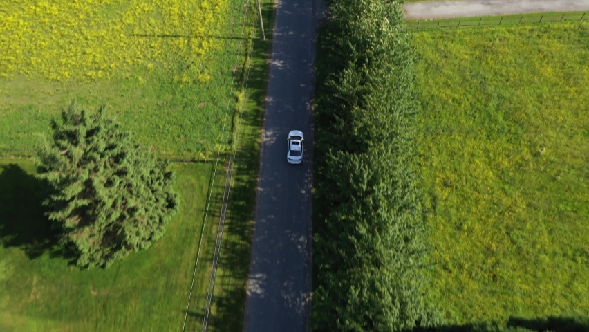 Footage of a white car driving into the distance revealing the beautifual rural areas of Chilliwack, BC. Filmed and produced on 26-6-2021