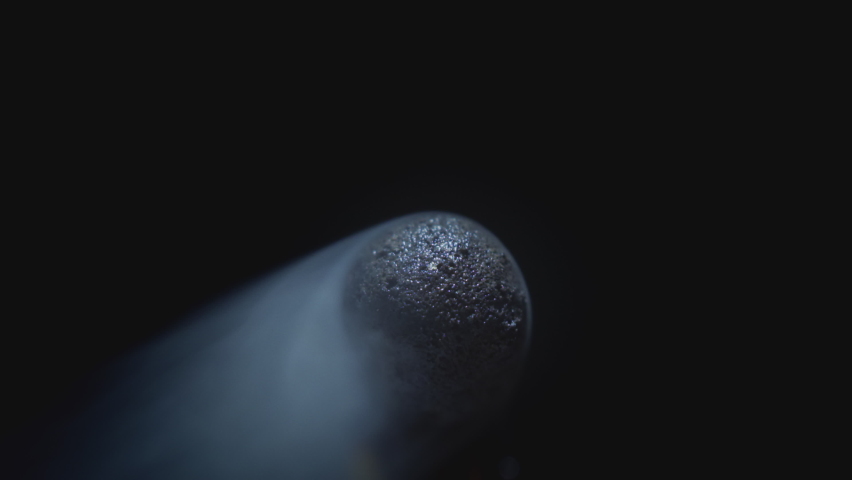 Matchstick with fire on the tip. Matchstick fires on Matchbox in macro slowmo. Macro Shot of Igniting Match against Black Background. Burning match, bright firelight | Shutterstock HD Video #1085329211