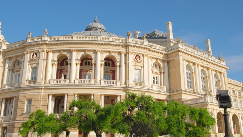 Historical Odessa theatre building at sunny day, Ukraine. Sunny morning in the historical center of Odessa at summer, Ukraine. Slow steadicam shot. Opera and ballet theatre