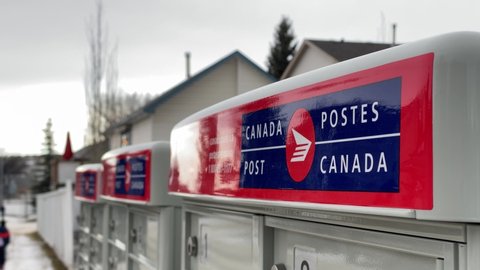 Calgary, Alberta. Canada. Jan 14, 2022. Close up to a Community mailbox from a Canada Post mail at a neighbourhood.
