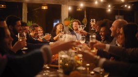 Big Dinner Party with a Small Crowd of Multiethnic Diverse Friends Celebrating at a Restaurant. Beautiful Happy Hosts Propose a Toast and Raise Wine Glasses while Sitting at a Table in the Evening. - Powered by Shutterstock - Get 15% off with code: PIKWIZARD15