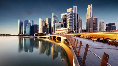 Time lapse of Singapore skyline panorama at sunrise - Marina bay with skyscrapers