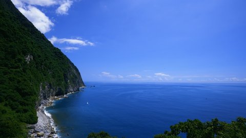 Sea, sky, mountains and sea facing each other, multi-layered blue of the coast. The Qingshui Cliff is the only coastal road in Taroko National Park. Hualien, Taiwan.