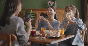 Asia teen girl vlogger group show share talk viral live vlog fun laugh smile look camera in  reel   mobile app Gen z youth people enjoy happy meal food at reopen retail cafe table