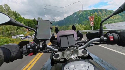 anchorage , Alaska , United States - 12 17 2021: Motorbike on the coastal road riding, Action cam point of view, Alaska road trip 