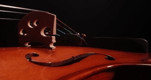  Violin on black background, close up dolly shot. Video for events, workshops music, education ads and music stores, music concept.
