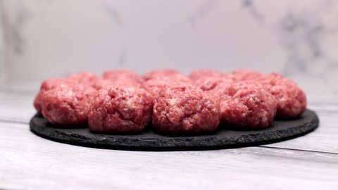 Homemade Minced Beef And Pork Cutlets, Meatballs, Nuggets, Kebab, Raw, On A Slate Tray. Dolly Slider Shot.