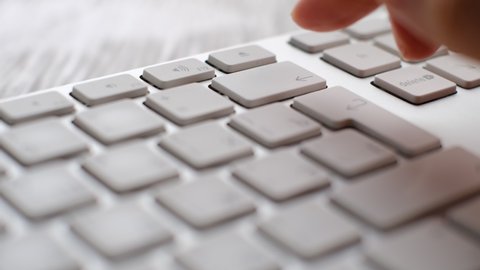 Enter button pressing on keyboard, laptop keyboard close up