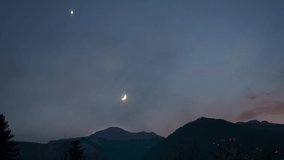 4K Time-lapse of moon setting over the snow covered Himalayan mountain range during the night at Manali in Himachal Pradesh, India. Moon sets behind the snowy mountain. Night time lapse of moon.  - Powered by Shutterstock - Get 15% off with code: PIKWIZARD15