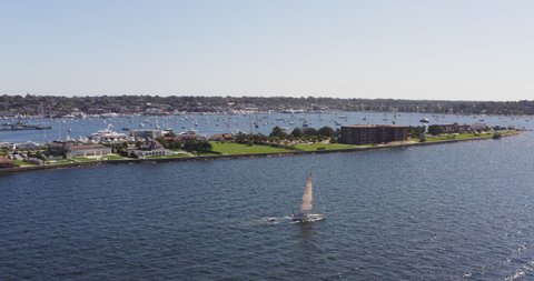 Aerial footage of harbor, marina, boats in Newport, RI.
