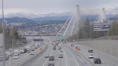 Surrey Central, Greater Vancouver, British Columbia, Canada - December 15, 2021: Traffic Driving on Trans-Canada Highway across Port Mann Bridge.