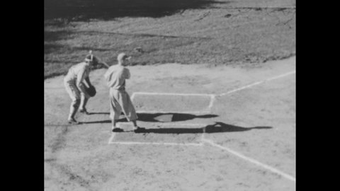 1940s: High angle, slow motion of baseball player at bat, player bunts ball, catcher throws ball. Players throwing ball to batter hitting ball.
