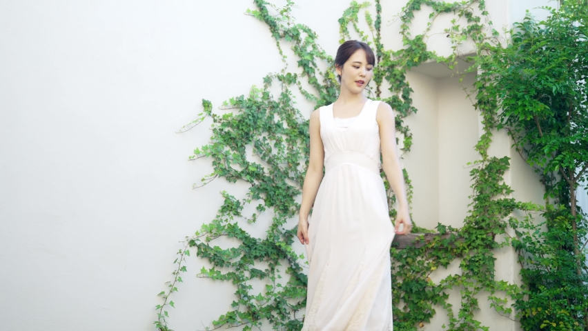 Young Asian woman wearing white dress. Bridal. Wedding.