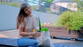 Young happy woman in beige t-shirt hold grocery tote shopping bag full of fresh vegetables. - Powered by Shutterstock - Get 15% off with code: PIKWIZARD15