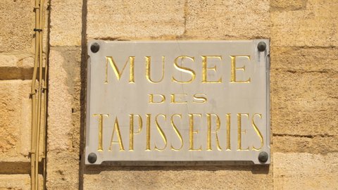 Aix-en-Provence, France - August 2021 : "Tapestry Museum" marble plate onn the facade on the Archdiocese Palace building in Aix en Provence