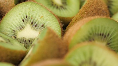 Kiwi fruit. Camera slowly moves down and showing fresh cutting kiwi fruits. Macro shot