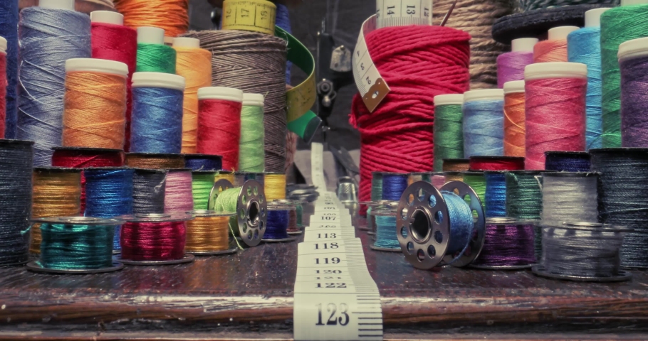 Small tailor workshop full of colorful thread on spools. Vintage weaving workshop. Royalty-Free Stock Footage #1085392148
