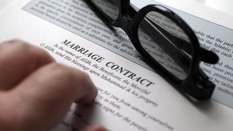 Finger tapping on islamic marriage contract
