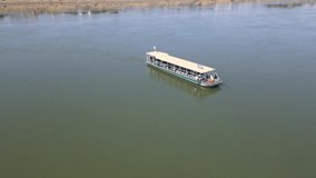 Aerial view of Ferry boat approching along the Mekong river in Mukdahan Thailand