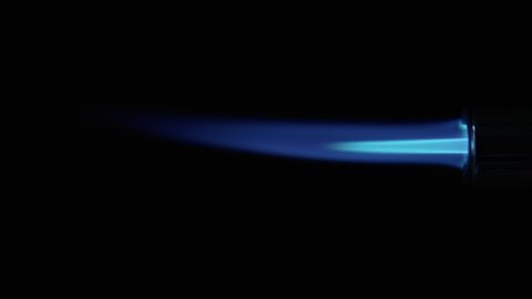 Butane Gas Flame switched on and off from nozzle against black from a butane torch burner in 50 FPS. Side view of Blue and yellow flame. Element for VFX and Compositing, e.g. as rocket propulsion