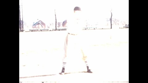 1940s: Baseball player swinging bat, stops in bunting position. Hands holding bat. Player walking, swinging bats, steps up to plate.