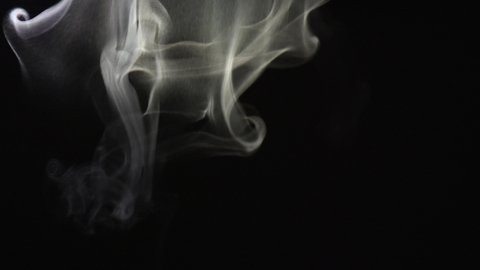 Smoke from top to bottom. Cloud of cold fog on black background. Realistic smoke best for using in composition, steam over black background. 4K UHD video footage 3840X2160.