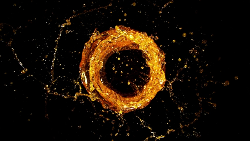 Super Slow Motion Shot of Rotating Oil Whirl Isolated on Black Background at 1000fps. Royalty-Free Stock Footage #1085420252