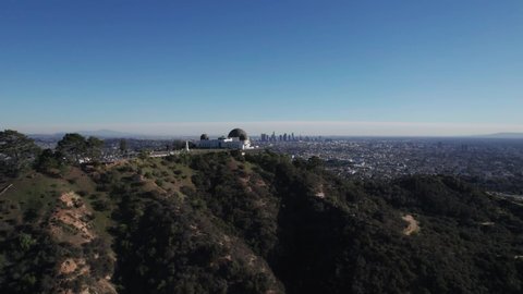 Los Angeles, JAN 10, 2022. Aerial drone view of Griffith Observatory, Beautiful sky during Sunset.