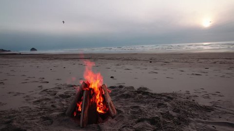 Bonfire Burning on a Beach Rock