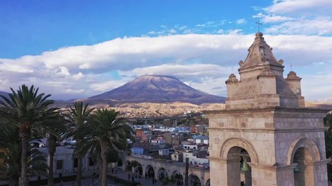 Arequipa bell tower cathdral and volcano drone