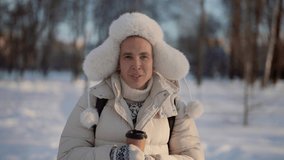 Portrait of a cute homosexual man walking outside in winter with hot coffee in his hands. - Powered by Shutterstock - Get 15% off with code: PIKWIZARD15