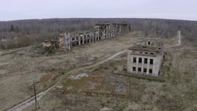 Aerial panorama by drone. Abandoned office buildings, forest, road, gas station