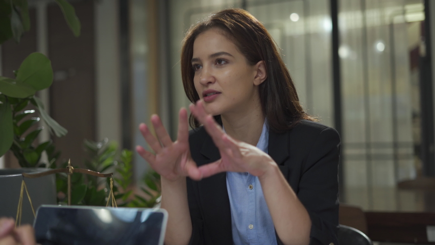 couple talking and working with laptop computer together in office.  business woman listening attentively from discussion with customer. lawyer conversation and legal advice with a client .