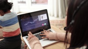 Trader mother studying stock market on streaming lesson with her child at home - Blockchain analysis concept - Powered by Shutterstock - Get 15% off with code: PIKWIZARD15