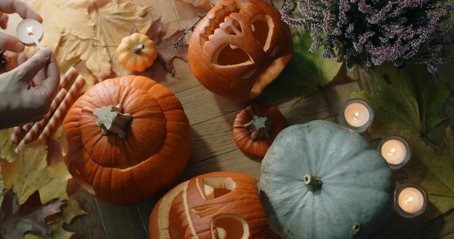 Table top of putting the candles inside the halloween pumpkin head, decorations for halloween, 4k 60p Prores HQ 10 bit
