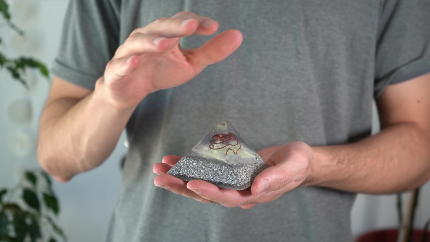 Close-up of man working with orgonite stone energies