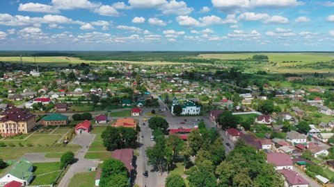 "Mir" is a town in the Karelichy District of Grodno Region.  Aerial view.  Landscape Of Village Houses. Catholic Church of St. Nicholas on background of blue sky. Mir,Belarus
