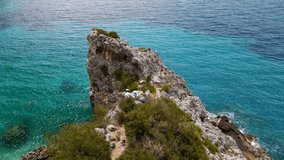 aerial view of happy woman at the cliff sea beach on background lefkada greece - Powered by Shutterstock - Get 15% off with code: PIKWIZARD15