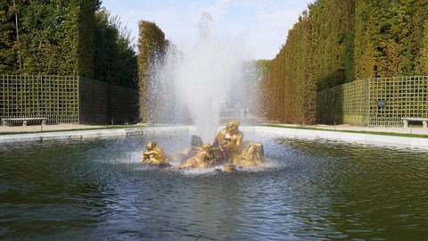 Versailles, France - October 17, 2021: Bacchus Fountain (or Autumn fountain) in the Gardens of famous Chateau de Versailles.