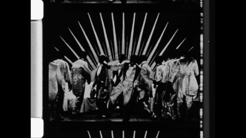 1910s Hollywood, CA. Negative Racial Stereotype of Black Men as performed by White Men in Black Face. Minstrel show performance of tap dance. 4K Overscan of Vintage Archival 16mm Film