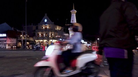 Jogjakarta, Indonesia - Dec 13,, 2021: Busy Night Street At White Paal (Tugu Jogja) an Icon of Jogja