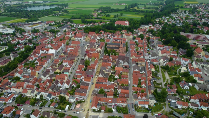 Aerial around the old town of the city Friedberg in Germany, on a sunny spring day.