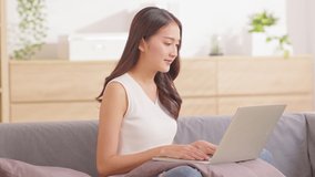 Asian young woman wear casual online meeting Video conference call with business team or family at home,young girl live streaming in social media online platform,Lifestyle at home concept