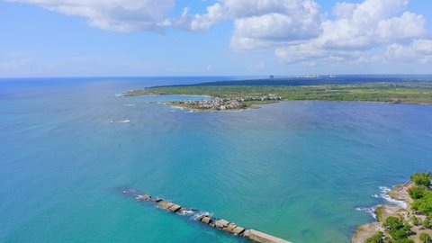 Malecon at San Pedro de Macoris and seascape, Dominican Republic. Aerial backwards