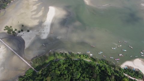 4K over Pier in National park with local fishing boats in Kapur District from aerial view by drone.